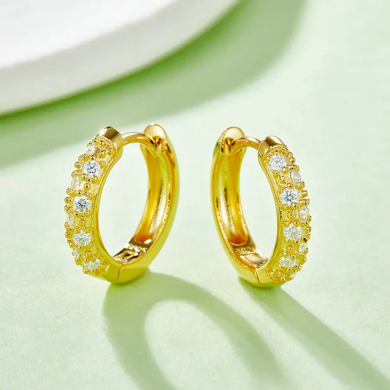 Yellow gold vermeil half-pavé huggie hoops, side view showing the full stone band on one half