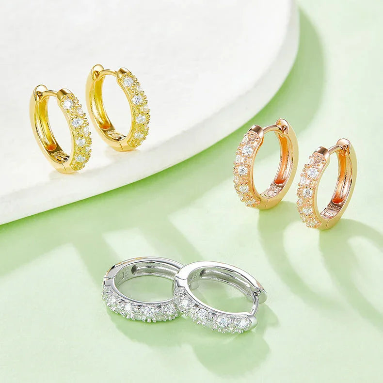 Mixed half pavé huggie hoop earrings: yellow, rose gold vermeil, and white gold vermeil pairs