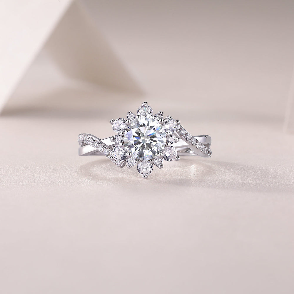 Moissanite engagement ring with round center stone, surrounding halo, and twist pavé band