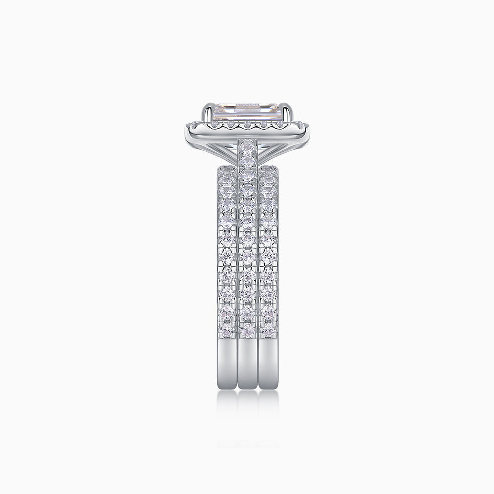 Side profile of emerald-cut halo ring set with pavé gallery, white gold vermeil