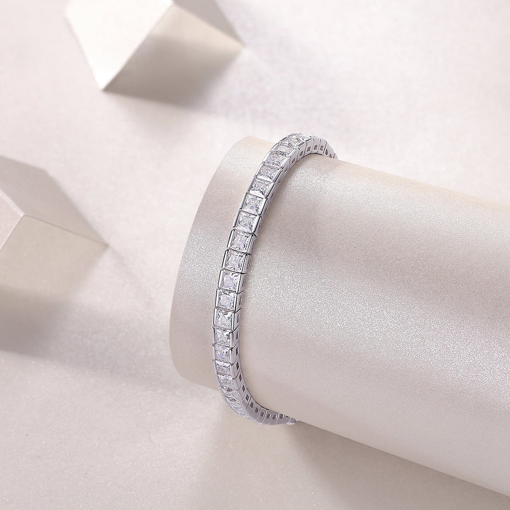 Princess cut moissanite tennis bracelet close-up, silver-toned link setting with square stones