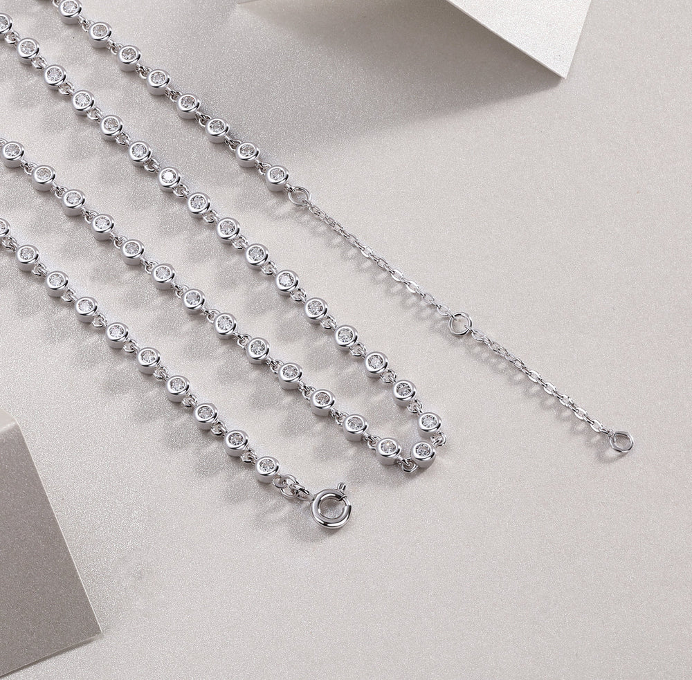 Tennis necklace clasp view with round bezel-set stones, white gold vermeil chain