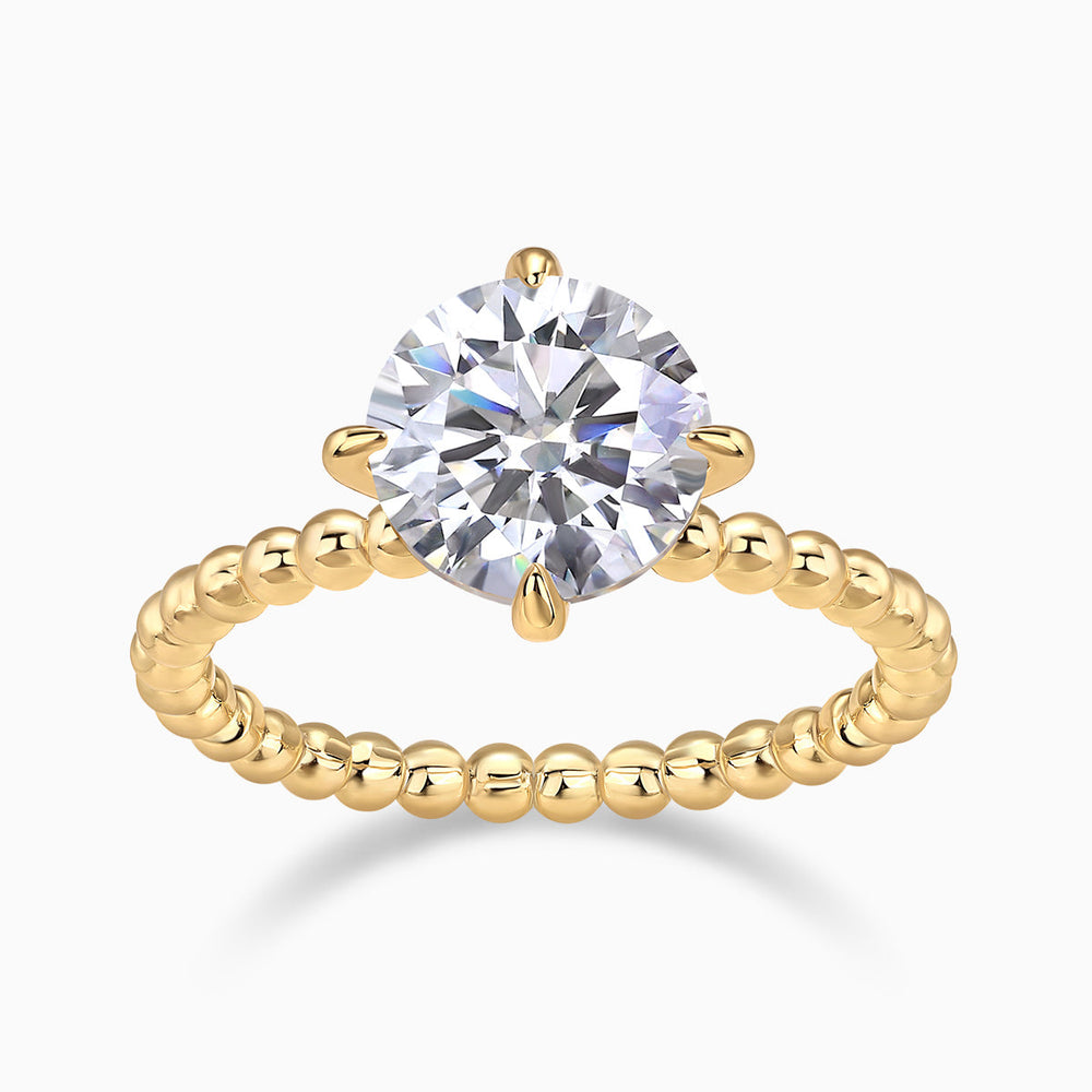 Yellow gold plated solitaire engagement ring with round moissanite center and beaded band
