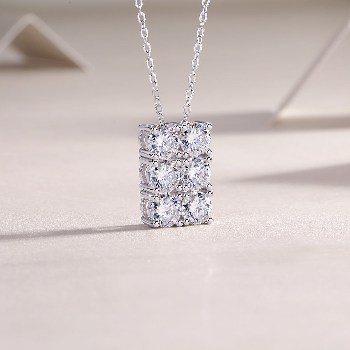 Openwork 6-stone moissanite cluster pendant, side view, white gold vermeil