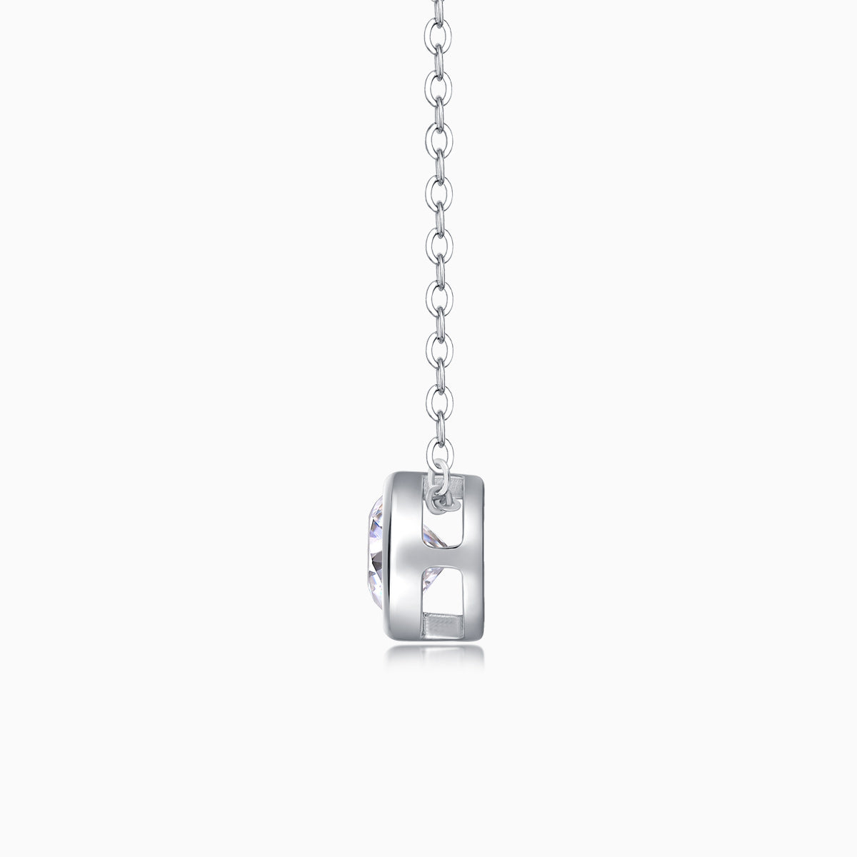 Back view of round bezel-set moissanite solitaire pendant on silver-tone chain