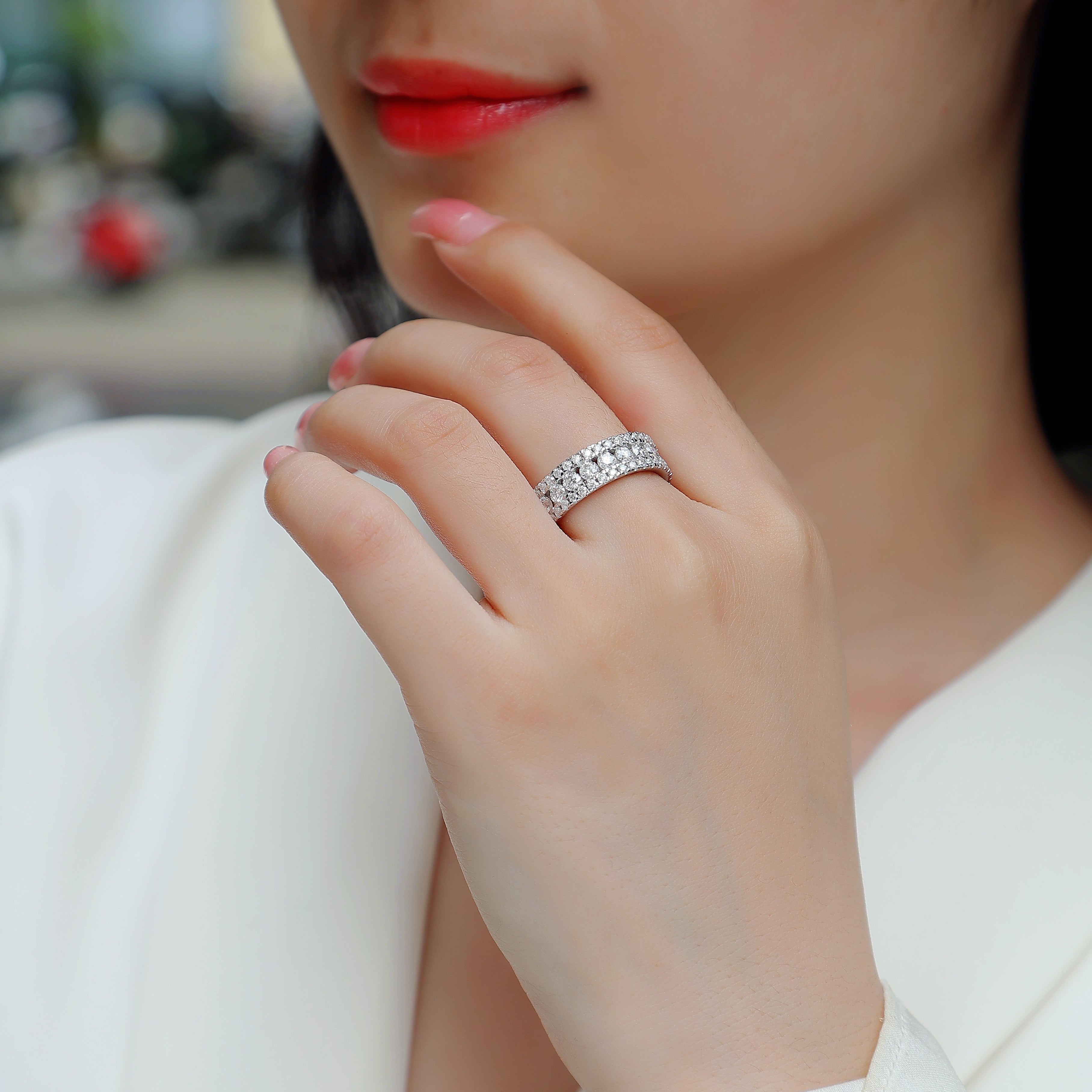 Triple Row Moissanite Eternity Band on hand, round pave stones in three rows