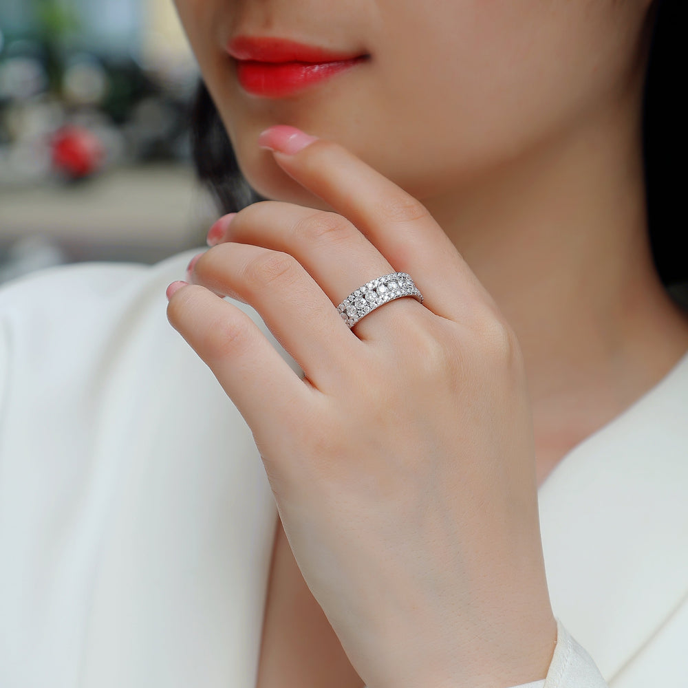 Triple Row Moissanite Eternity Band on hand, round pave stones in three rows