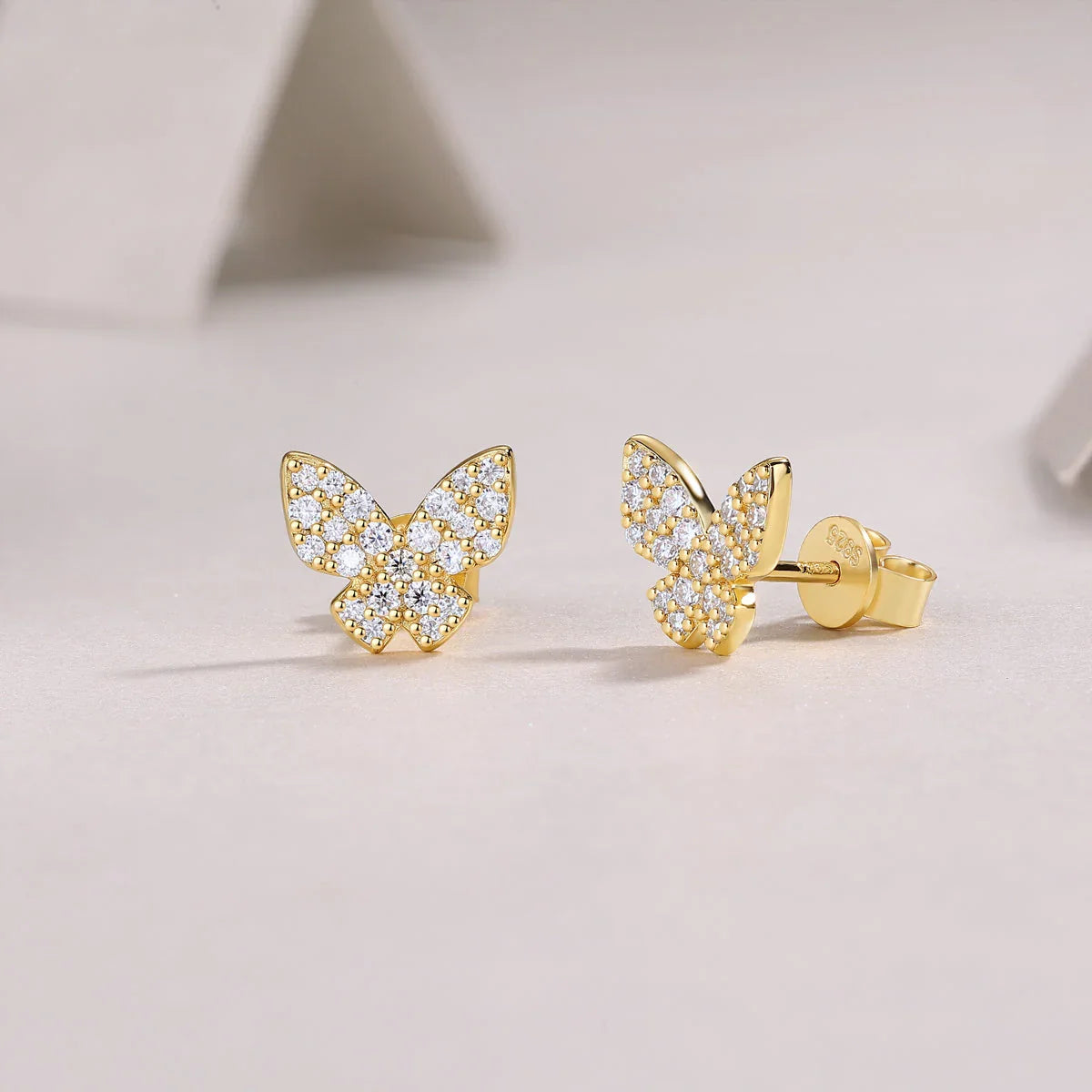 Butterfly stud earrings, front view, yellow gold vermeil pavé moissanite