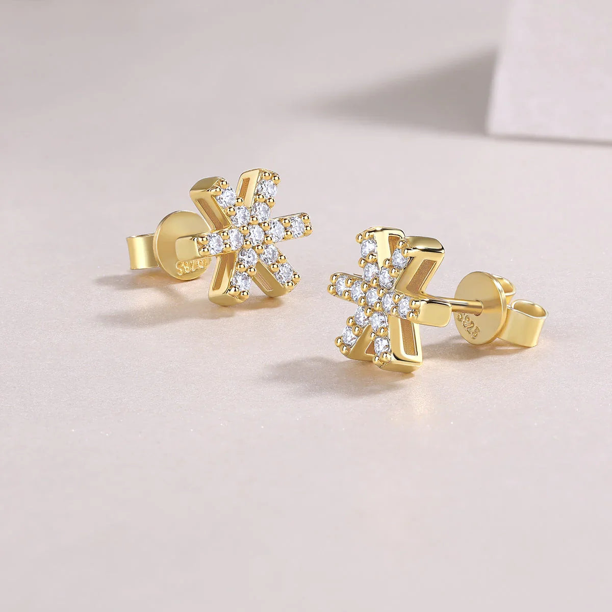 Snowflake moissanite stud earrings, yellow gold vermeil, earring back and post visible