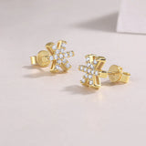 Snowflake moissanite stud earrings, yellow gold vermeil, earring back and post visible