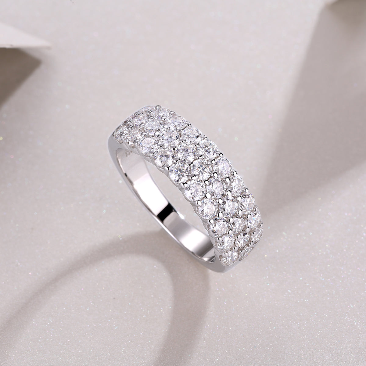 Side view of white gold vermeil eternity band with continuous round moissanite stones