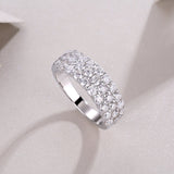 Side view of white gold vermeil eternity band with continuous round moissanite stones