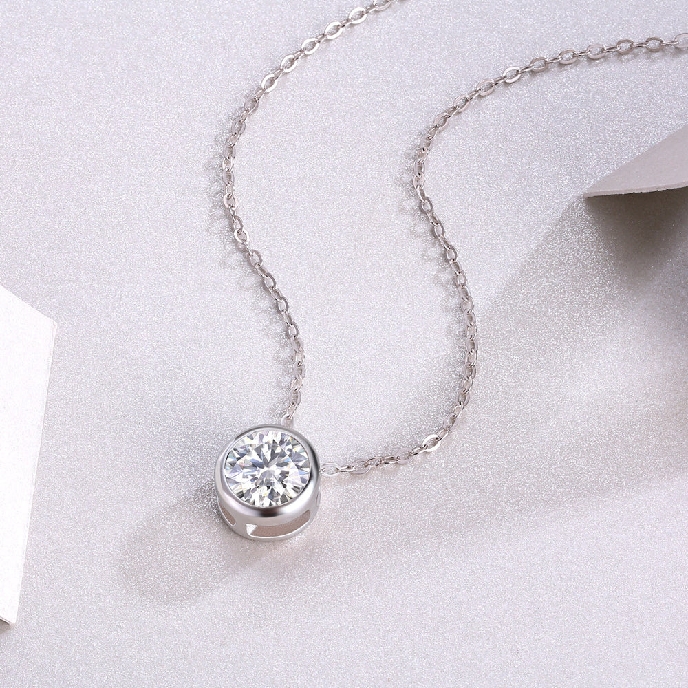 Round moissanite solitaire pendant in bezel with chain links, white gold vermeil look