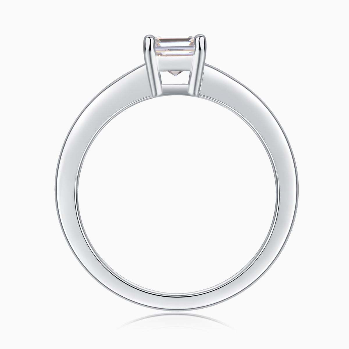 Solitaire emerald-cut moissanite ring, back view showing open prong basket