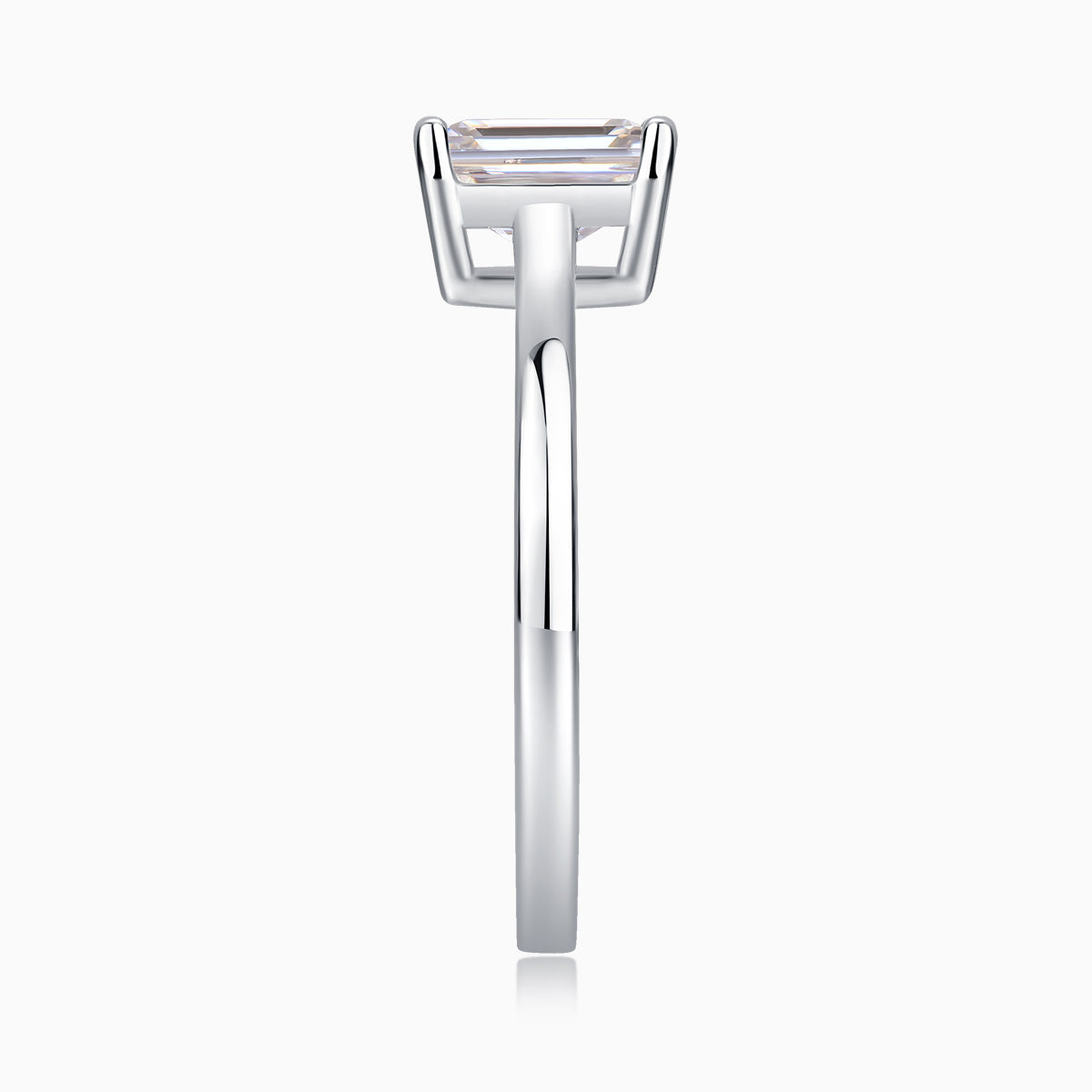 Solitaire emerald-cut moissanite ring profile, thin band with prong-set stone