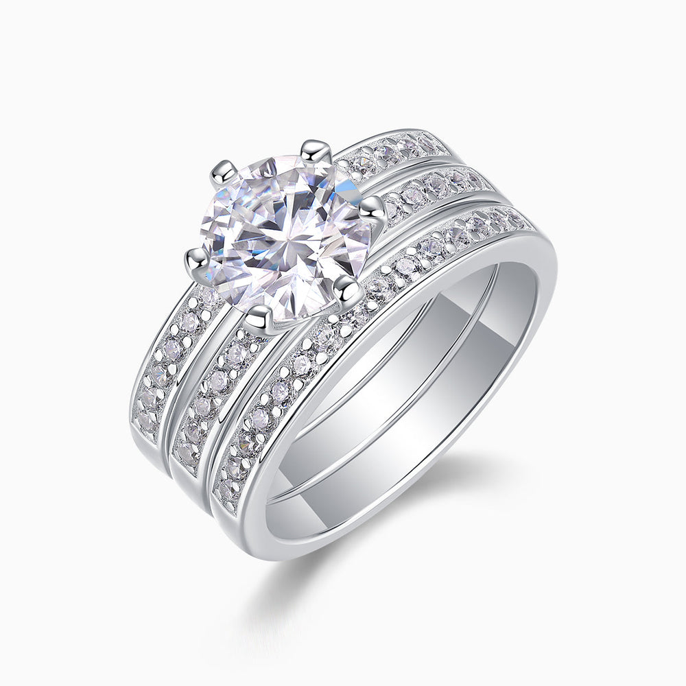 Angled view of 3-piece stackable rings: round center moissanite with pavé sides