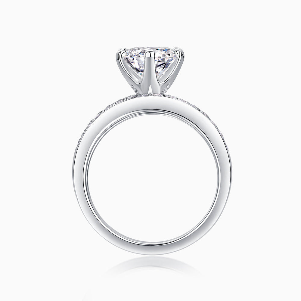 Side view of round moissanite stackable ring set with pavé bands