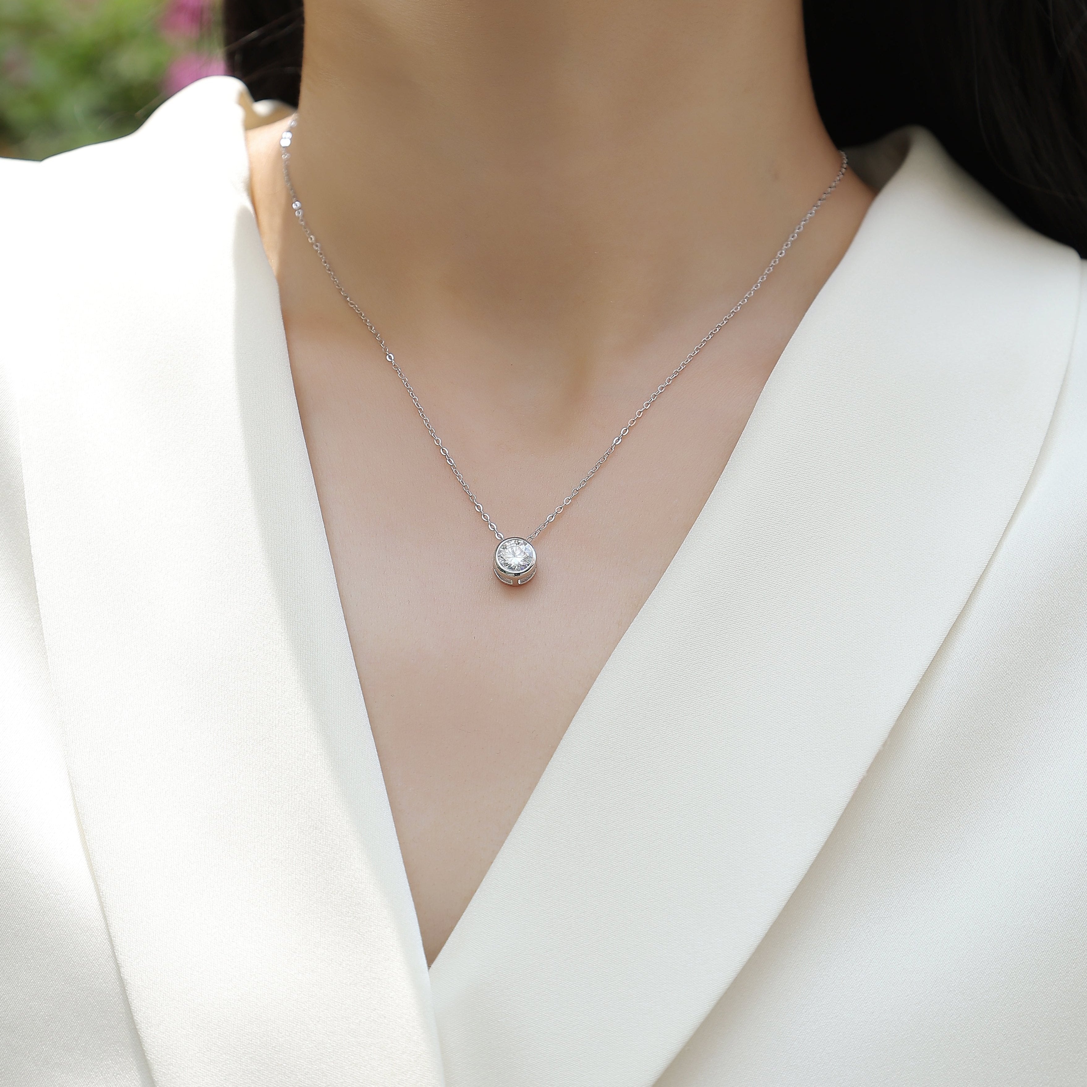 Moissanite solitaire pendant necklace with round stone in bezel on chain