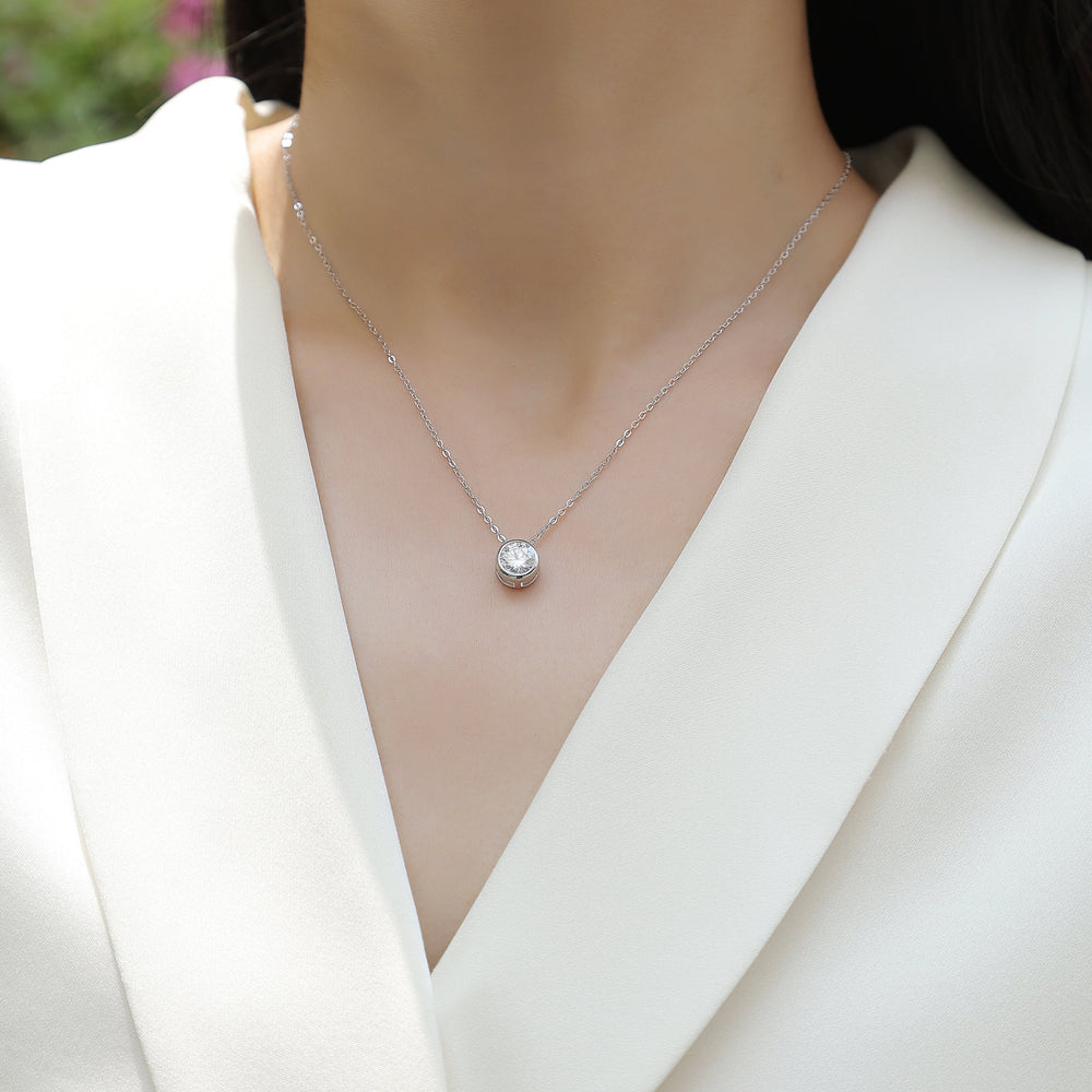 Moissanite solitaire pendant necklace with round stone in bezel on chain