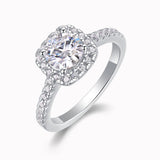 Round halo pavé moissanite ring, close-up side prongs and sparkling pavé details