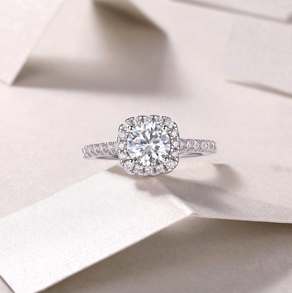 Round halo pavé moissanite ring, top view with circular halo and pavé band