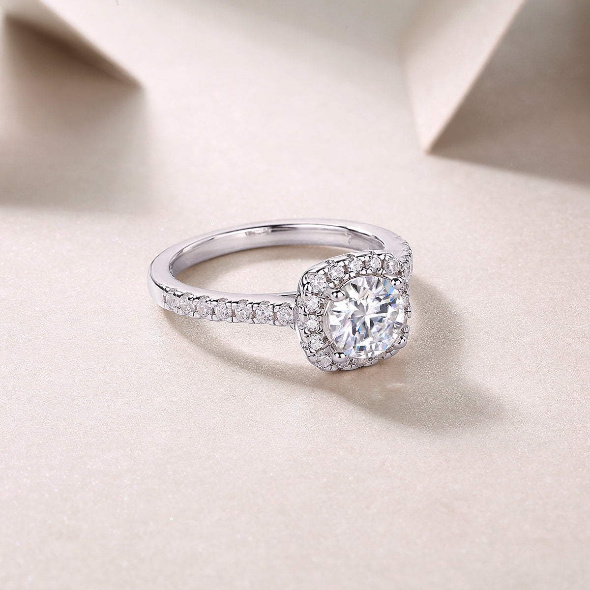 Round halo pavé moissanite ring, three-quarter view with pavé side stones