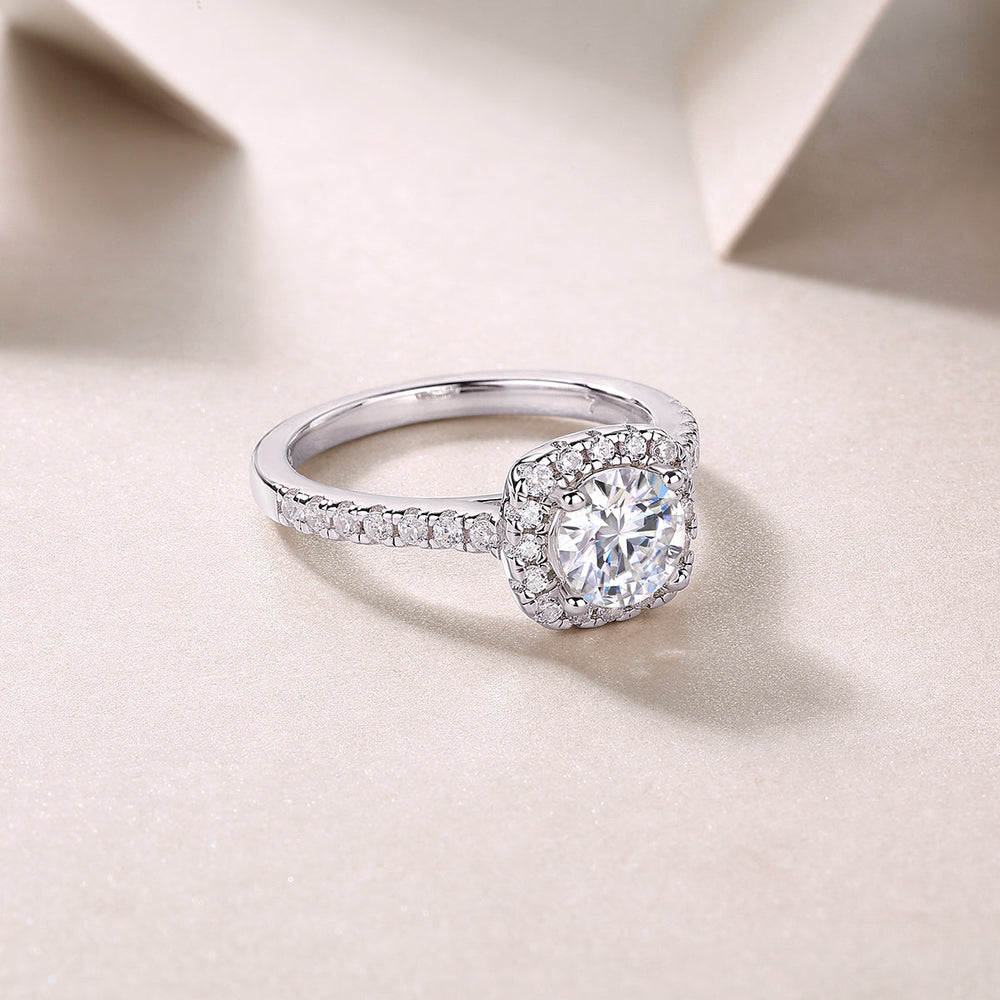 Round halo pavé moissanite ring, three-quarter view with pavé side stones