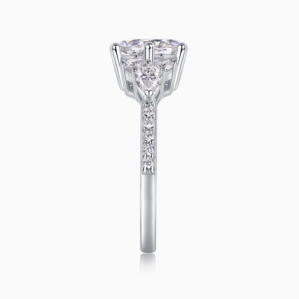 Moissanite pavé ring front view with round center stone and pavé halo, white gold