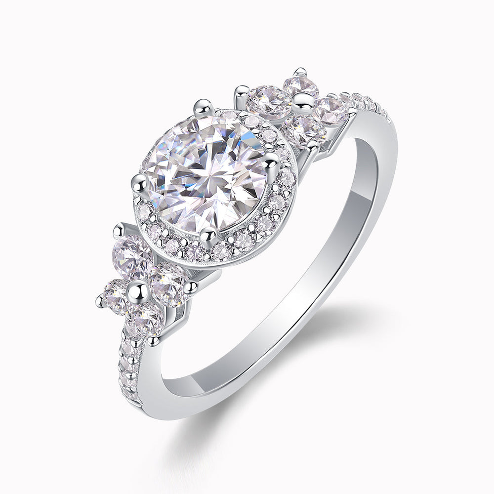 Angled view of round halo cluster moissanite ring with pavé side stones