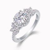 Angled view of round halo cluster moissanite ring with pavé side stones