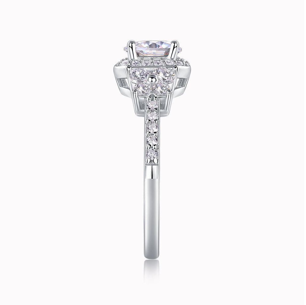Front view of round halo cluster ring with central stone and pavé side detailing