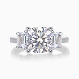 Three-stone cushion-cut moissanite ring with large center stone and side baguette stones