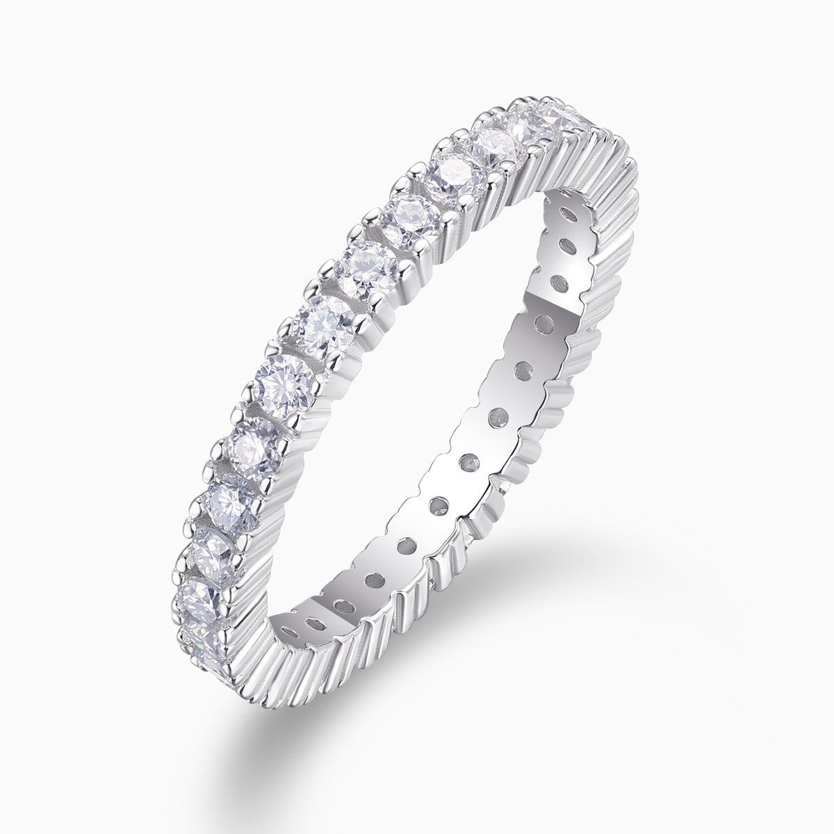 White moissanite pavé stacking ring, angled view showing round stones and ridged setting
