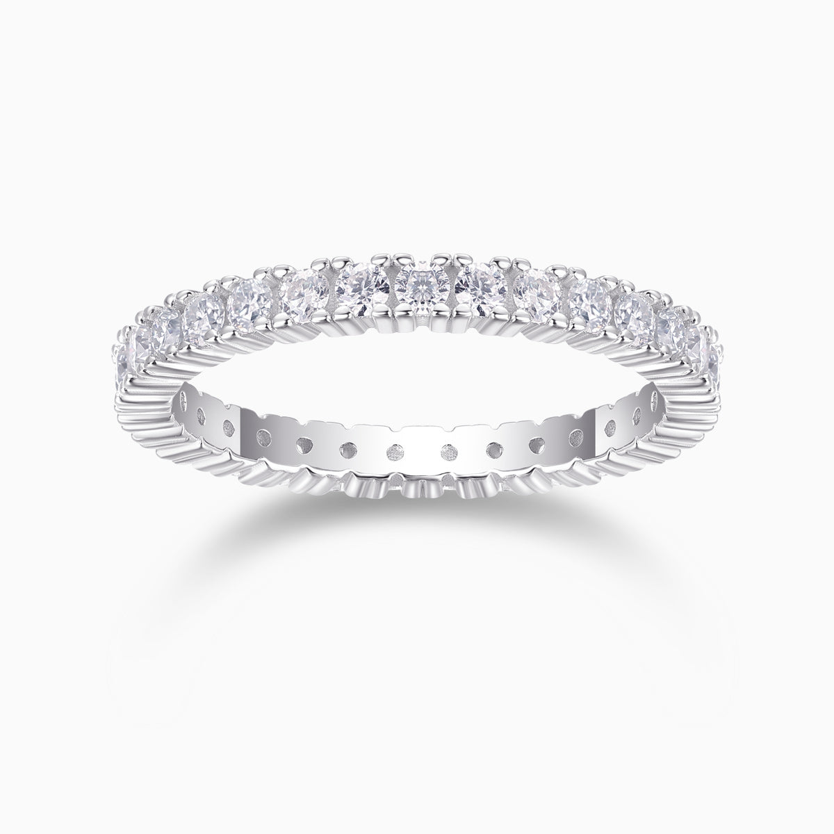 Minimalist moissanite pavé stacking ring in white metal with oval stones along the band