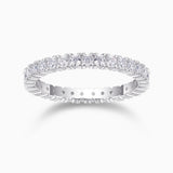 Minimalist moissanite pavé stacking ring in white metal with oval stones along the band