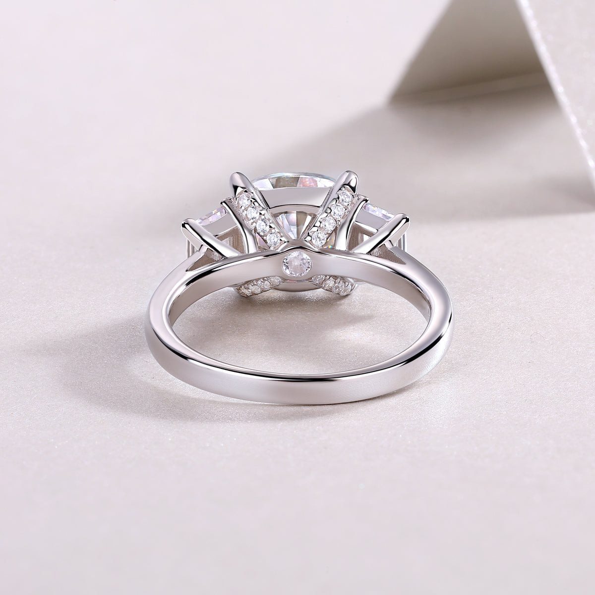 Ring underside view showing center setting prongs and pavé detail