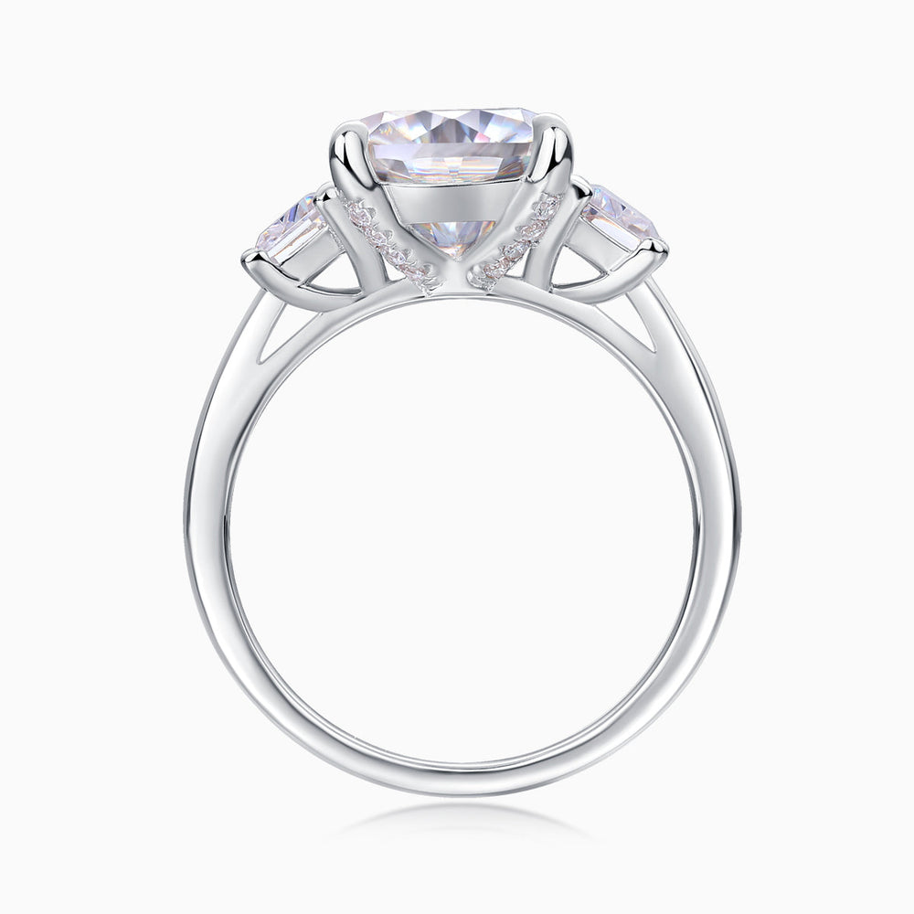 Cushion-cut moissanite ring with V-shaped prongs and small side pavé accents
