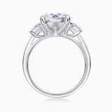 Cushion-cut moissanite ring with V-shaped prongs and small side pavé accents