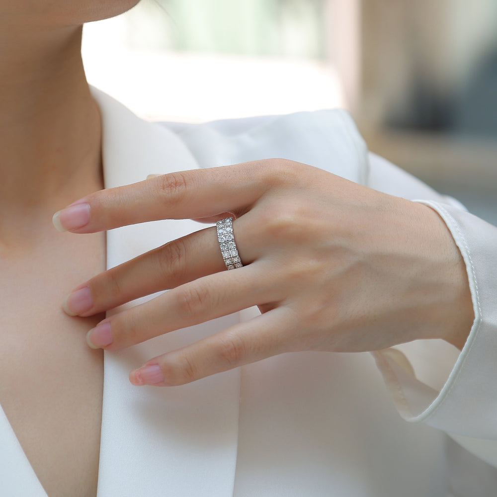 Moissanite half pavé double-row band ring on hand with small white stones