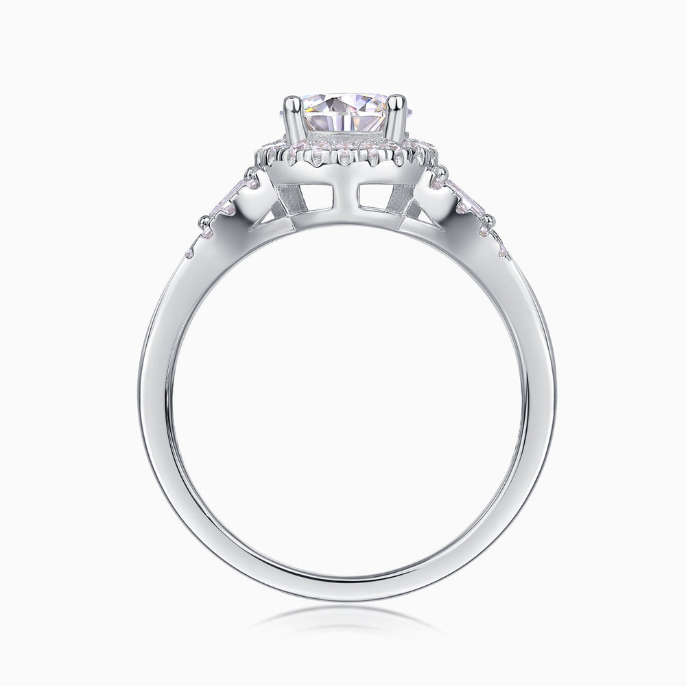 Round halo pavé moissanite ring profile view with prong-set center stone and pavé shoulders