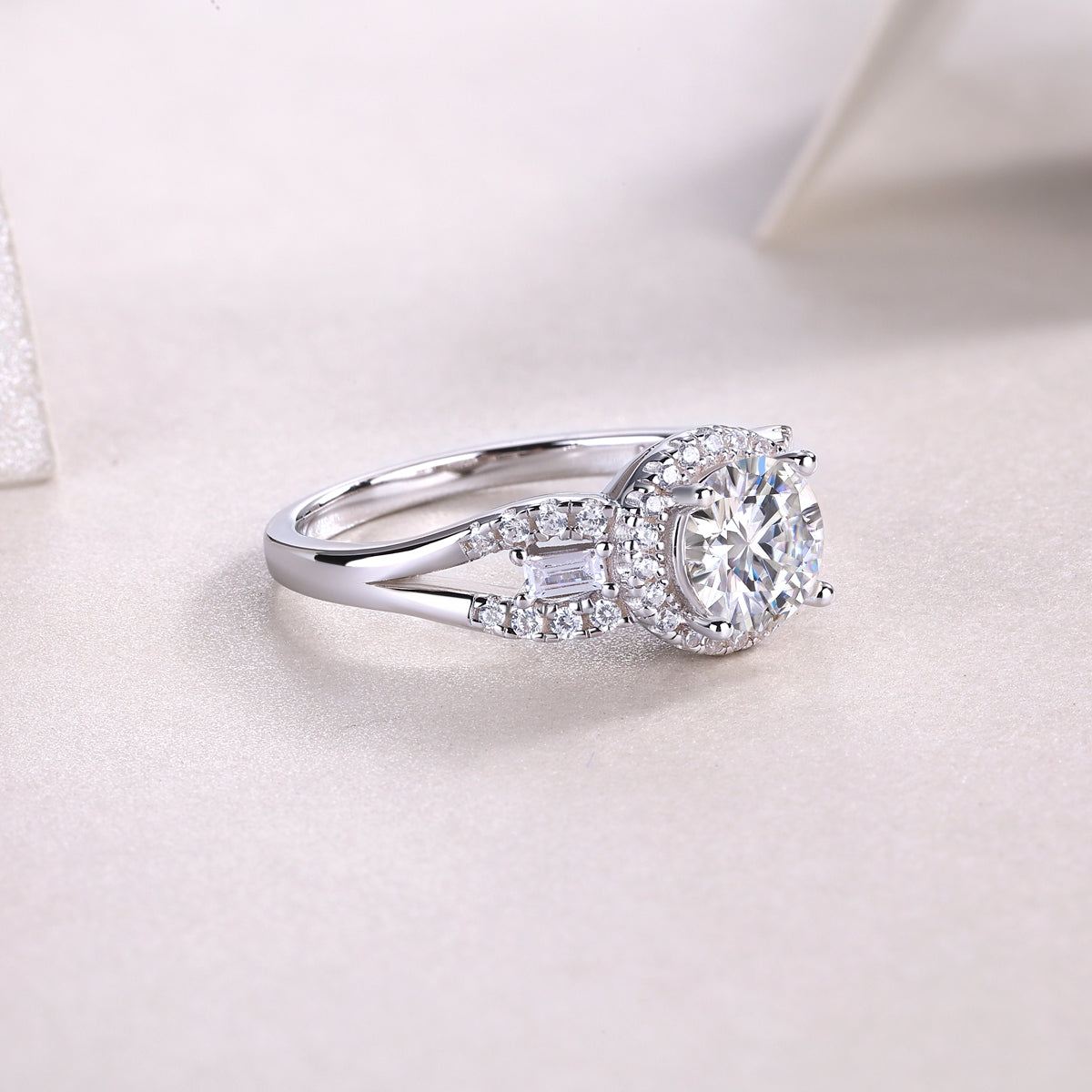 Round halo pavé moissanite engagement ring close-up with center round stone and engraved pavé details