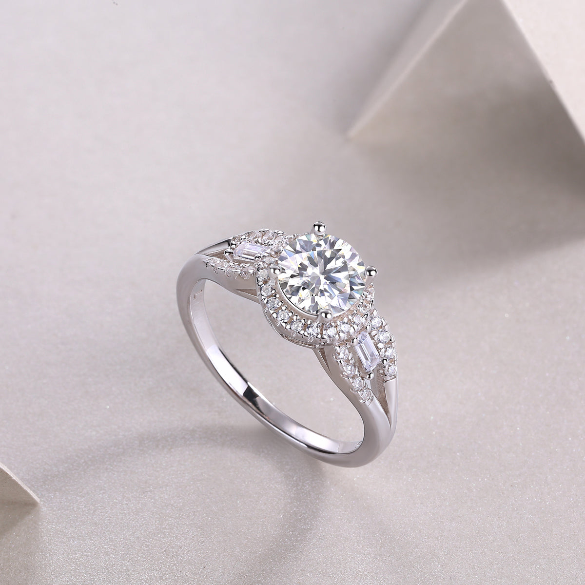 Round halo pavé moissanite ring angled view with center round stone and side pavé stones