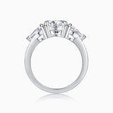 White gold-plated three-stone moissanite ring with prong-set round center stone