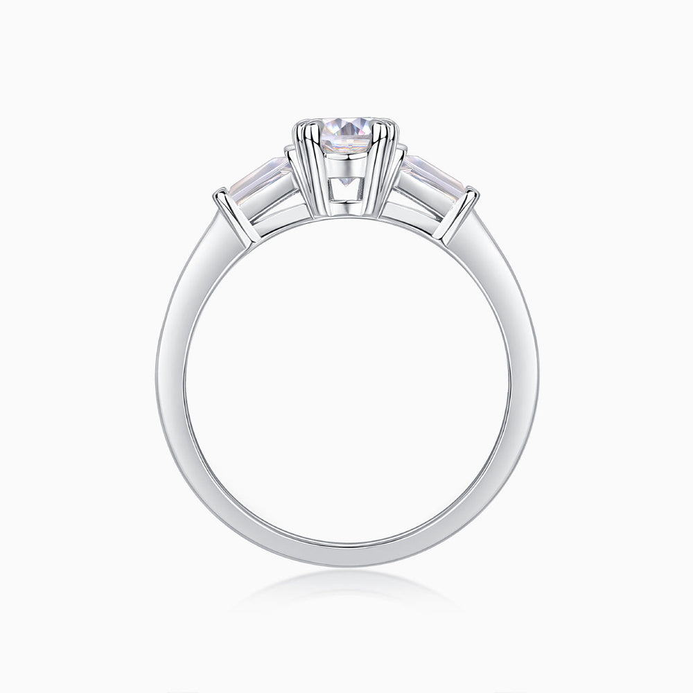 Back view of three-stone ring: oval center with baguette side stones, open band