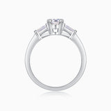 Back view of three-stone ring: oval center with baguette side stones, open band