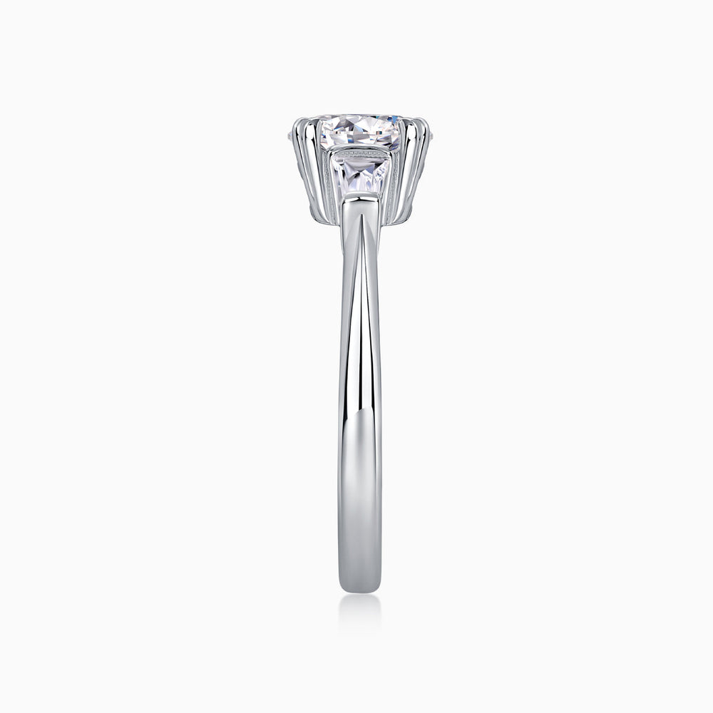 Top view of three-stone oval moissanite ring, high prong set on white gold