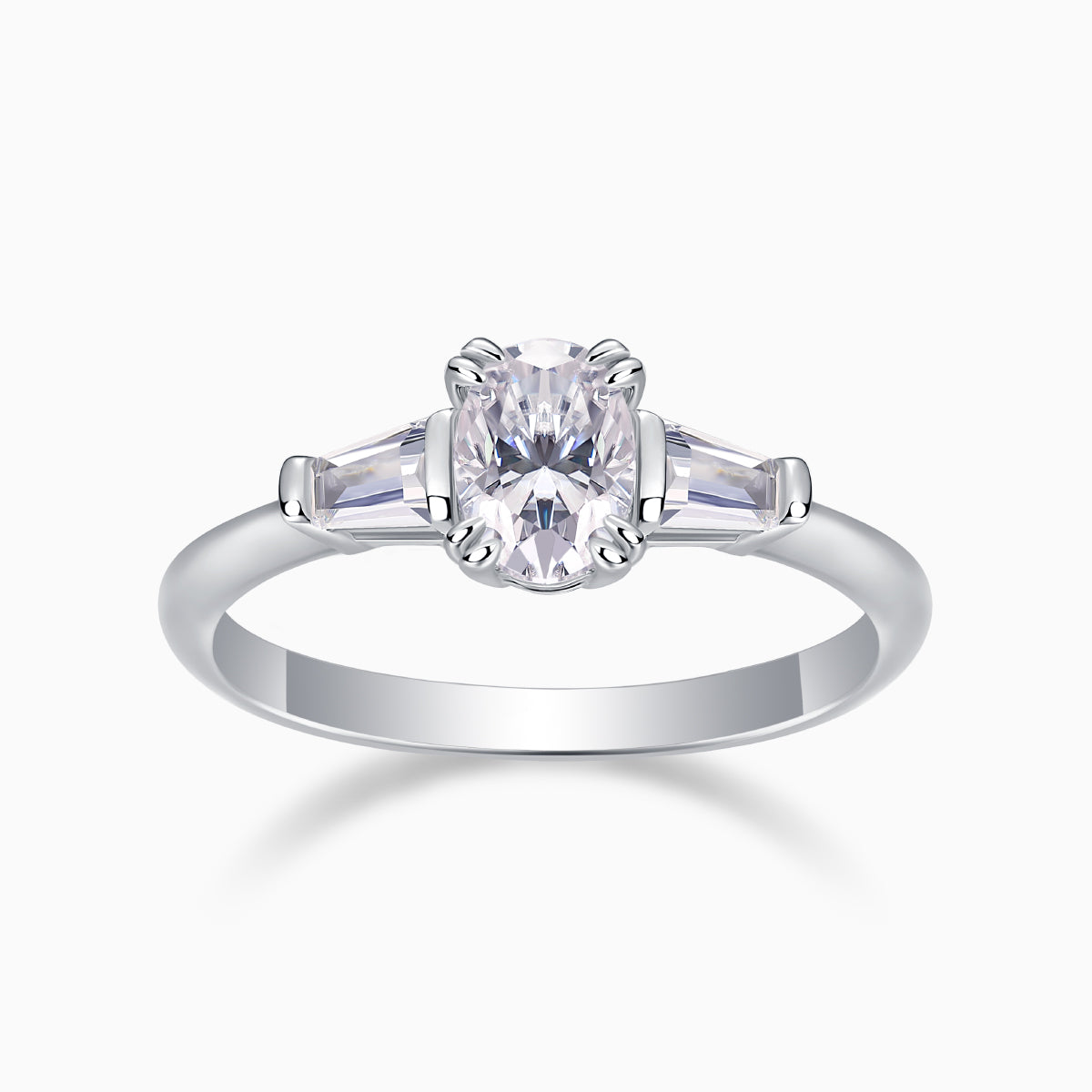 Three-stone oval moissanite ring in white gold, central oval with side baguettes