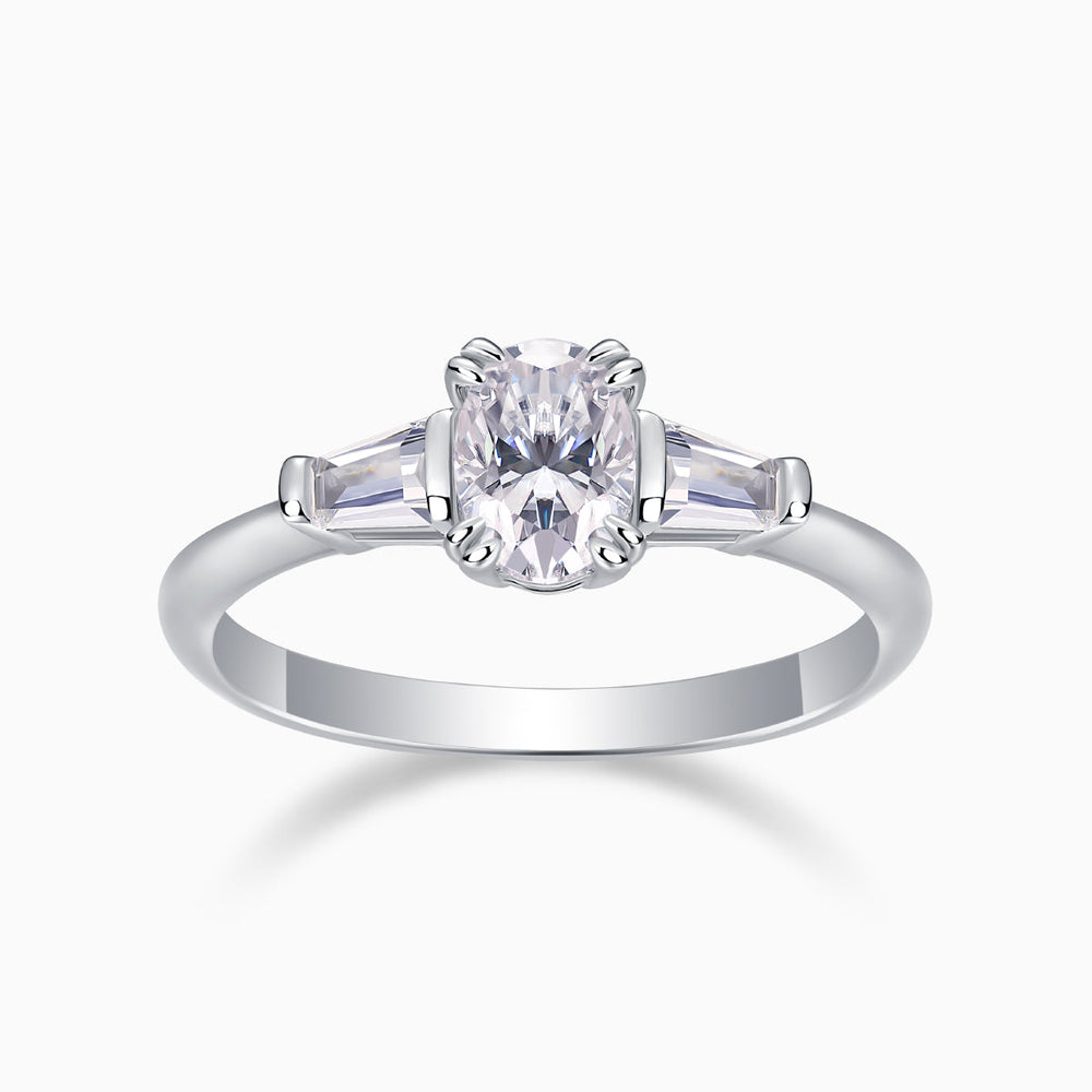 Three-stone oval moissanite ring in white gold, central oval with side baguettes