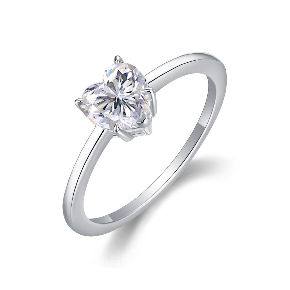 Heart-cut moissanite solitaire ring, close side view with heart-shaped bezel prongs