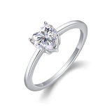 Heart-cut moissanite solitaire ring, close side view with heart-shaped bezel prongs